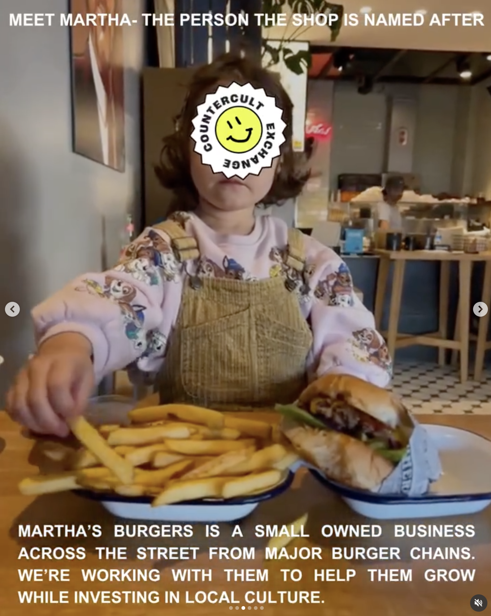 Martha’s Burgers participant with a burger and fries