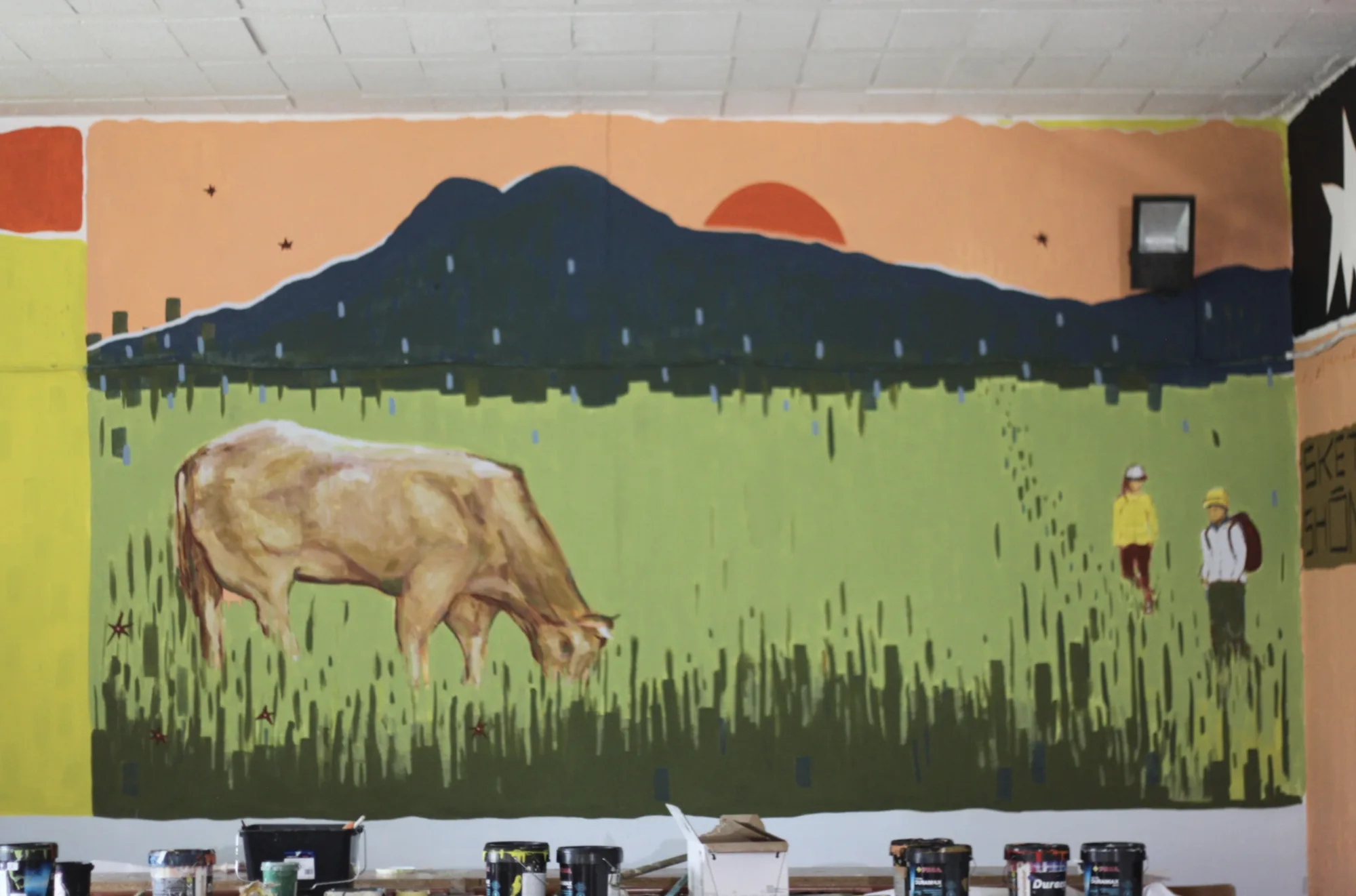 Detail of the Rural Hackers mural showing the Galician landscape and local life